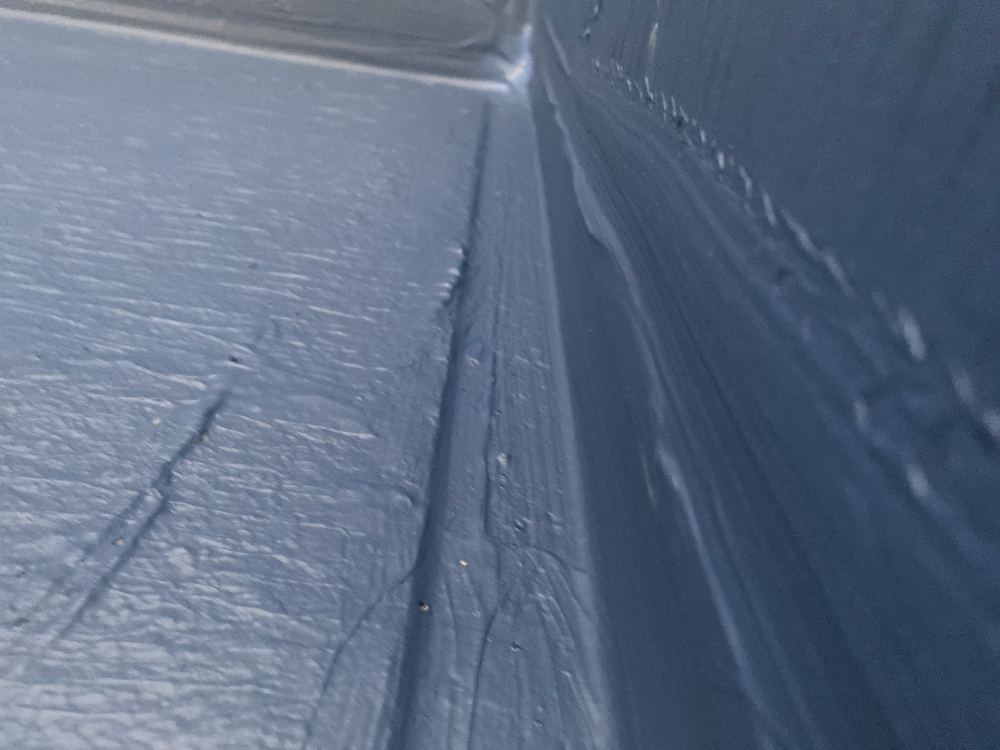 Shower floor to wall joint without a bond breaker, letting water puddle, found during a waterproofing inspection in Pennant Hills